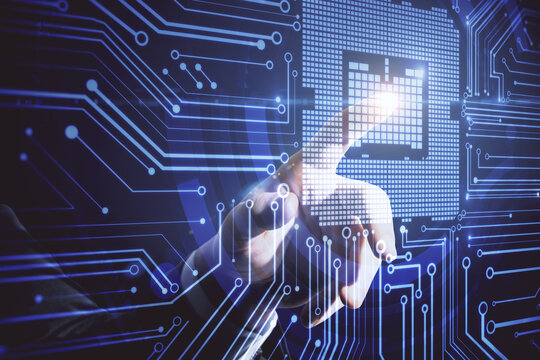 Businessman hand pointing at abstract circuit chip.
