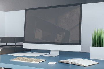 Fototapeta premium Contemporary office desk and computer with blank screen.