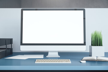 Side view computer with blank white screen.