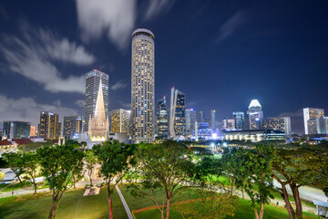 Singapore - St. Andrew's Cathedral and Swissôtel The Stamford at night