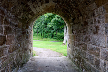 Fototapeta na wymiar View Through Old Stone Underpass in a Country Estate