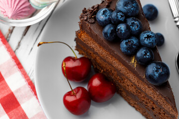 Piece of chocolate cake served with fresh berries