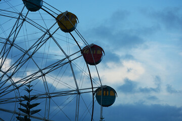 ferris wheel against blue sky