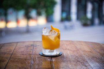 yellow cocktail on ice