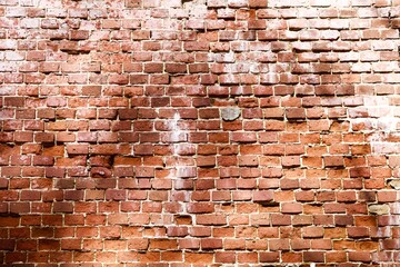 Old Brick wall surface close up. Bricks wall Texture. Loft interior and exterior design. Bricks in the wall. Brickwork close up view. Natural vintage stone walls pattern. Antique stonework Texture.