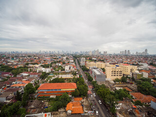 Naklejka na ściany i meble Panorama of the city of Jakarta, the capital of Indonesia, in cloudy weather.