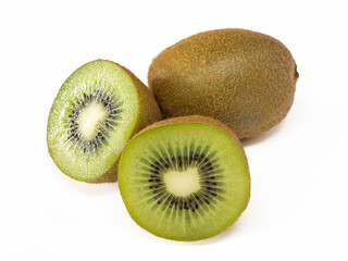 Close-up of two kiwis, one of them cut in half. Isolated on a white background.