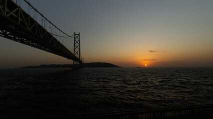 Fototapeta na wymiar Akashi-Kaikyo Bridge during sunset