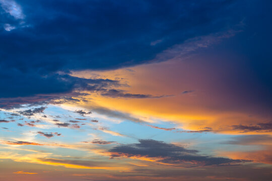 Colorful sunset. Dramatic sky background with dark clouds. Abstract natural sky background. © notistia
