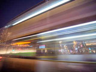 Fototapeta na wymiar Blurred traffic lights at night in Hong Kong.