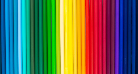 Background of multi-colored pencils. Bright stationery