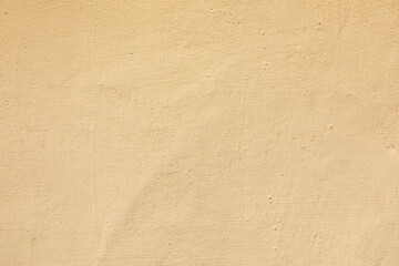 detail of ocre harmonic painted  plaster wall