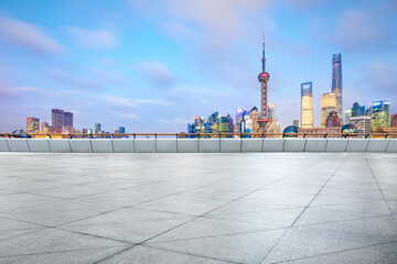 Fototapeta na wymiar Empty square floor and Shanghai Lujiazui commercial building scenery at sunset,China.