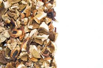Background of dried mushrooms on a white surface. Porcini mushrooms, aspen, boletus. Copy space