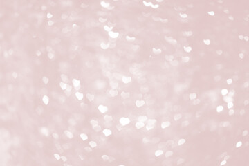 Pastel pink hearts lights bokeh background.