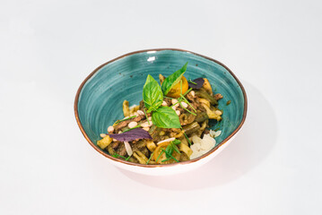 Delicious tagliatelle pasta and pesto on a white plate