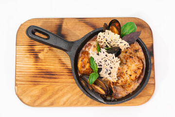 Tasty and satisfying julienne with seafood on a white background