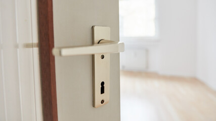 Open room door with a handle as a move or move-in concept