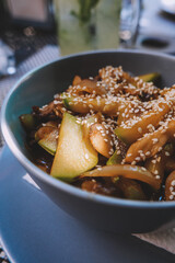 beef wok with vegetables on terrace