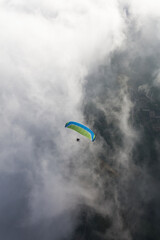 Paraglider above the clouds