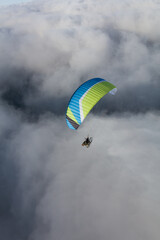 Paraglider above the clouds