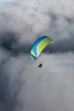 Paraglider above the clouds