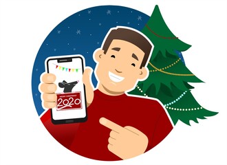 Smiling guy with a phone on the background of the Christmas tree. Shows the phone screen, points to it with a finger. Rat, greeting card on the screen. Merry christmas, happy new year. Round icon.