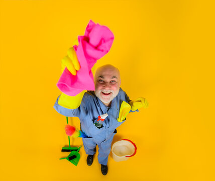 Cleaning rag. Cleaning equipment. Bearded man with rag. House cleaning. Professional cleaning. Clean up. Clearing tools. Household. Housekeeping.