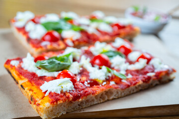 Pizza margarita with cherry tomato, basil and morzzarella cheese