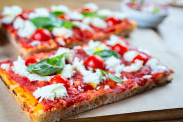 Pizza margarita with cherry tomato, basil and morzzarella cheese