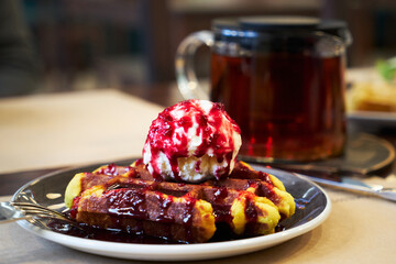 Brussels waffles with ice cream and jam.