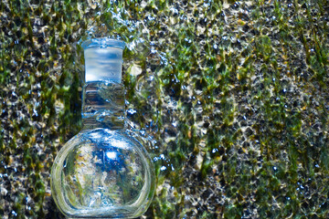 Glass flask with clear water.