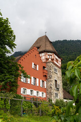 Fototapeta premium vertical view of the historic 13th-century Red House in Vaduz in Liechtenstein