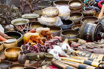 Selective focus. Some souvenirs on the street market stall near Bodnath stupa, Kathmandu, Nepal.