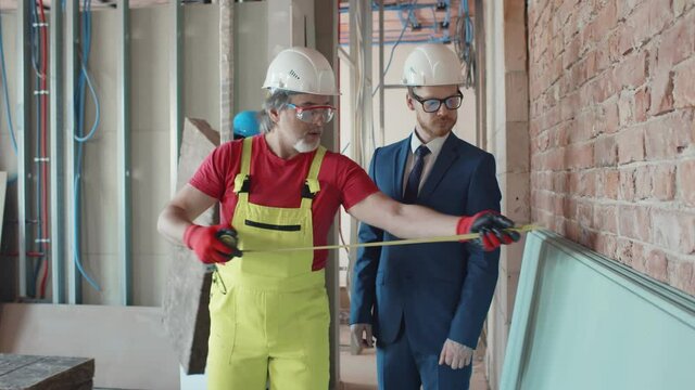 Young businessman visiting industrial construction site