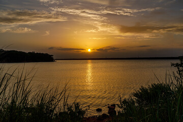 Beautiful Sahara Dust sunset over a lake in Oklahoma.