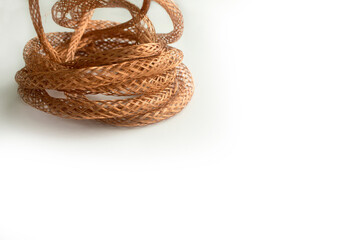 Fototapeta premium Twisted copper mesh wire . isolate on a white background.