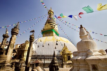 Old Buddhist Stupa in Himalaya on Bright colorful clear sunset sky background. Traditional buddhist...