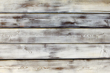 Vintage gray wooden texture of textured boards. Background of an old painted wooden wall. Gray abstract background. Vintage wooden dark horizontal boards. Front view with copy space.