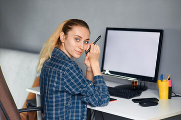 young woman working on laptop