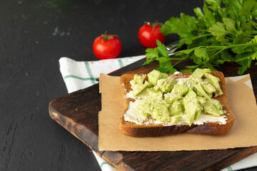 Fried toast with cream cheese and avocado slices