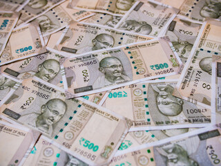 Indian money with 500 rupee bills in unfolded form.