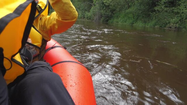 River rafting in summer. Packrafting in wilderness. Paddle in a boat on the river. Derzha River, Tver Region, Russia.