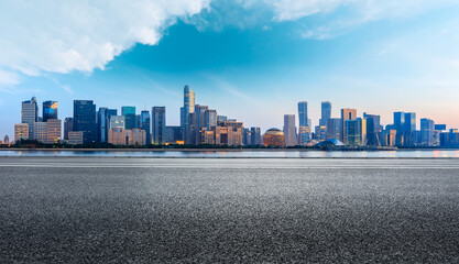 Hangzhou city skyline and buildings with asphalt road at sunrise,China.