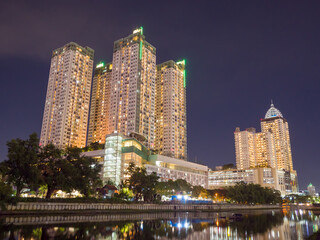 Fototapeta na wymiar Night photo of the residential building of the capital of Indonesia - Jakarta.