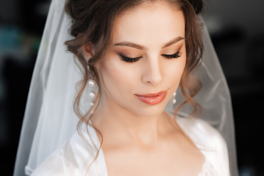 portrait of a pretty bride with makeup and hair styling