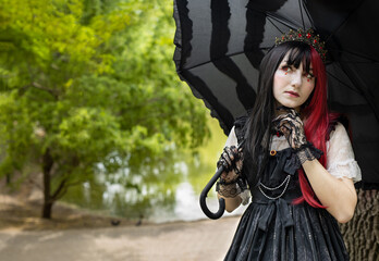 Gothic girl walk in park