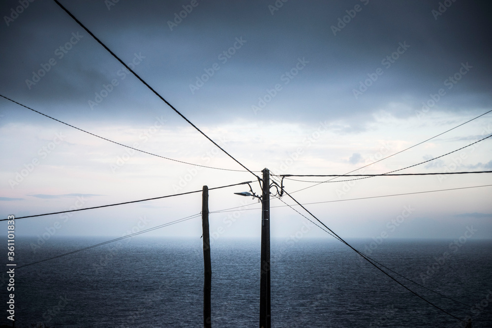 Wall mural wooden pylon with wires