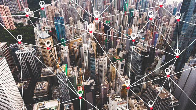 Aerial photo of a business district in China with many tall skyscrapers. Hong Kong office buildings with infographics design. Wireless cityscape map, internet and networking connection concept