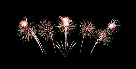 Beautiful fireworks display on black sky. New year celebration concept..